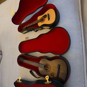 2 Mini Guitars With 3 Cases.